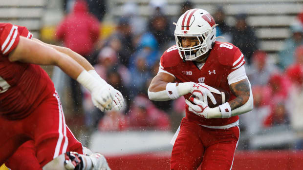 Wisconsin running back Braelon Allen carrying the football against Maryland at Camp Randall Stadium.